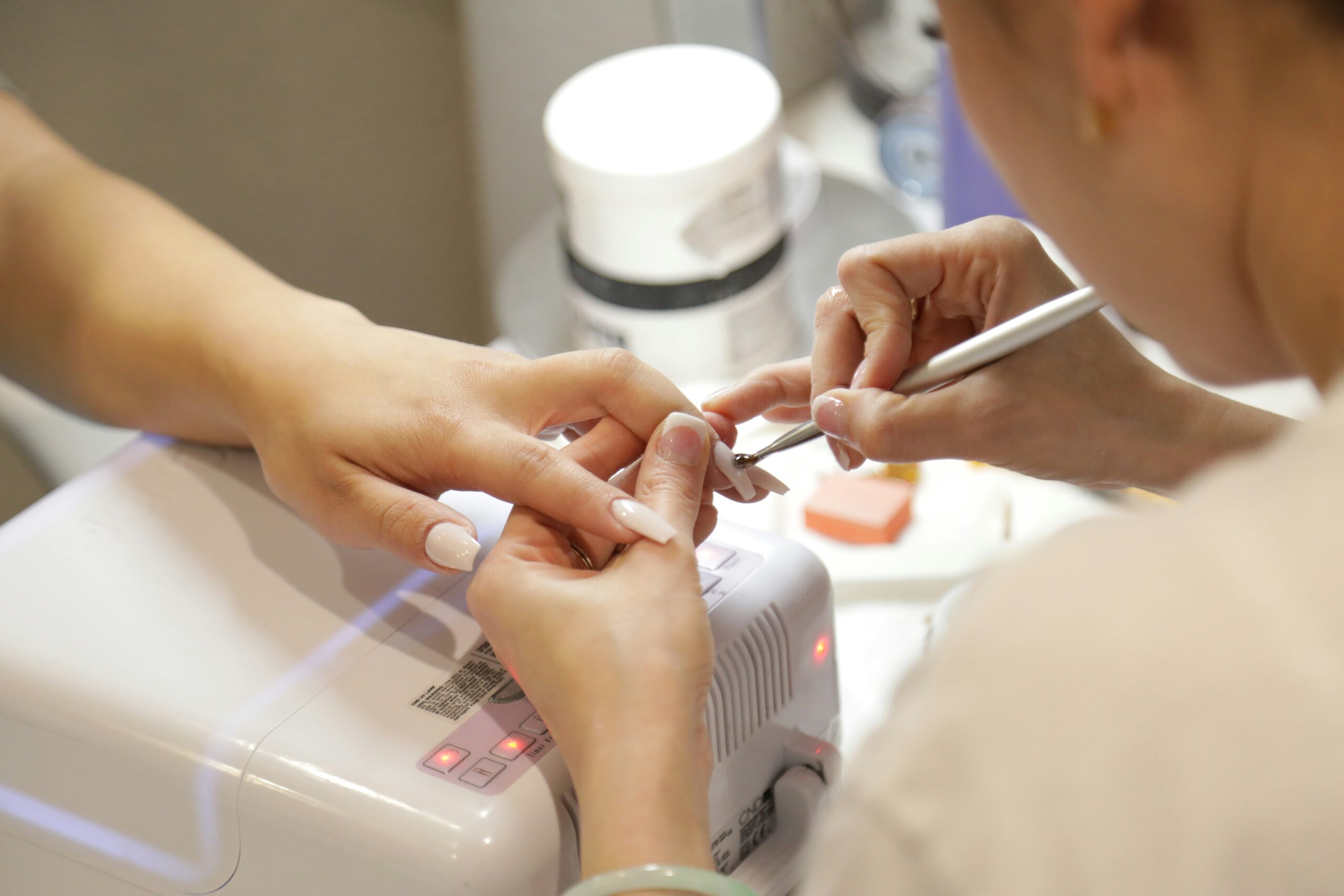 a woman receiving a nail treatment at levansha nail and beauty clinic